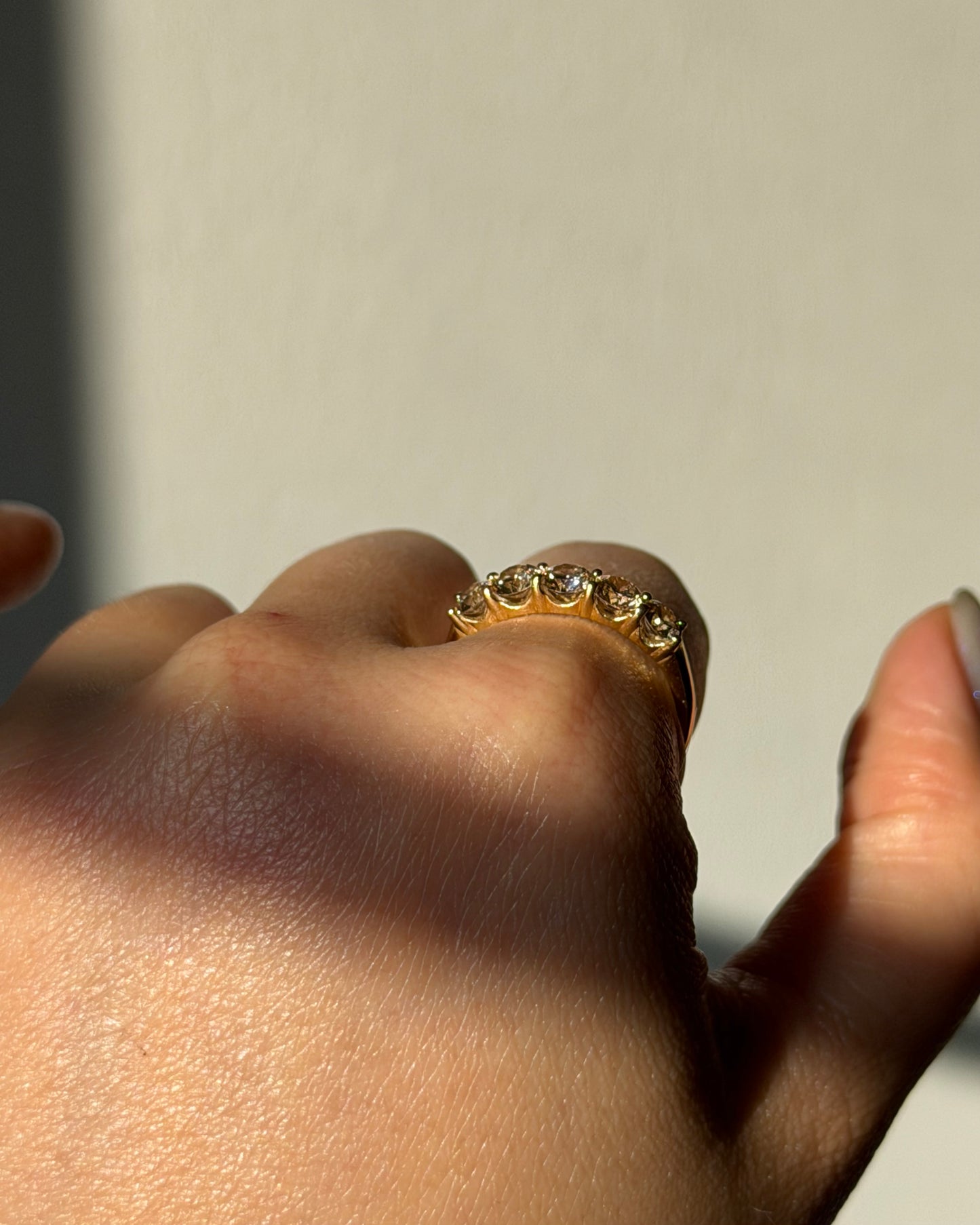 Modern Pre-loved 18k Gold Shared Prong 1.0 CTW Light Brown Diamond Band