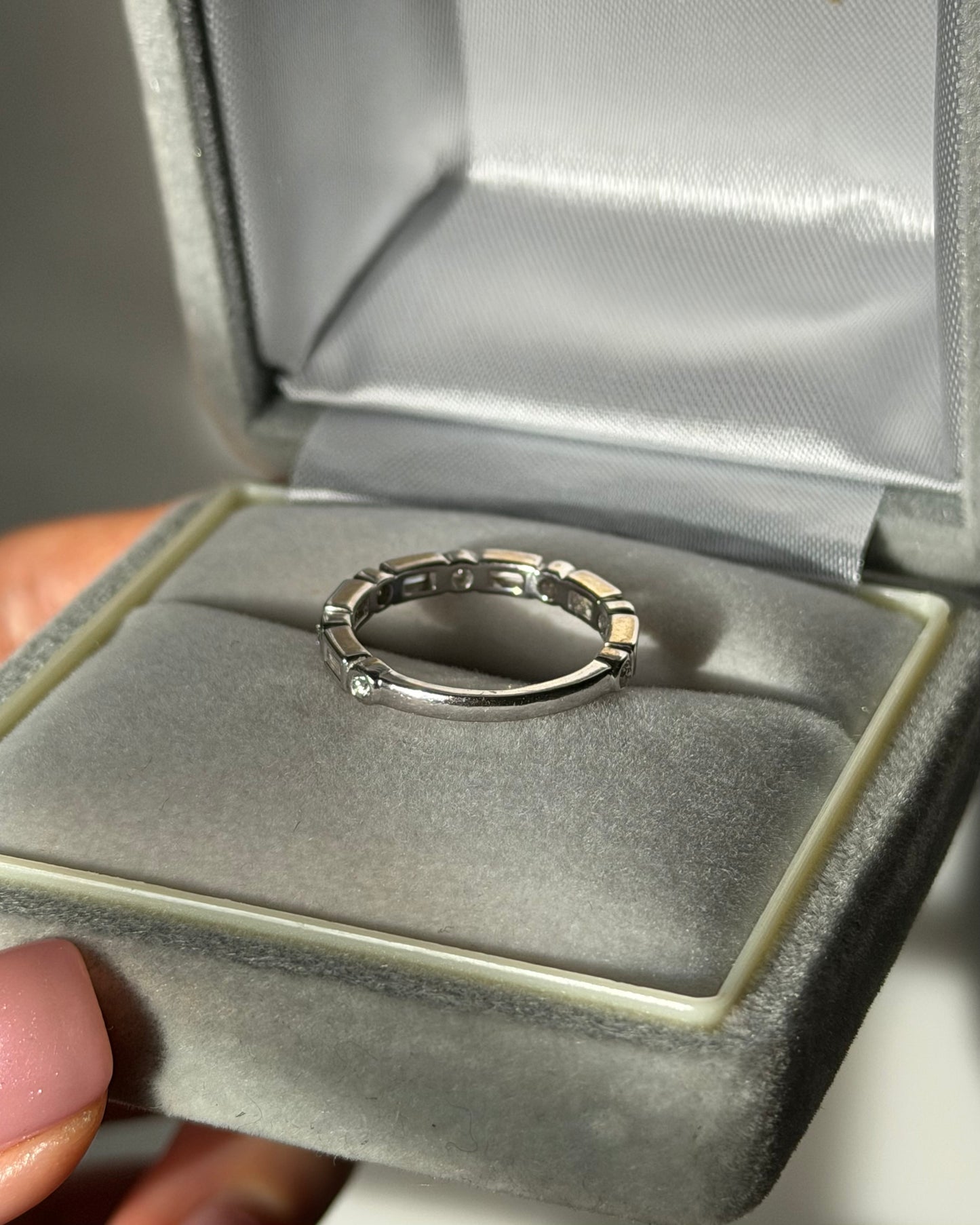 Modern Pre-loved 18k White Gold Bezel Set Baguette and Round Diamond Stacking Band