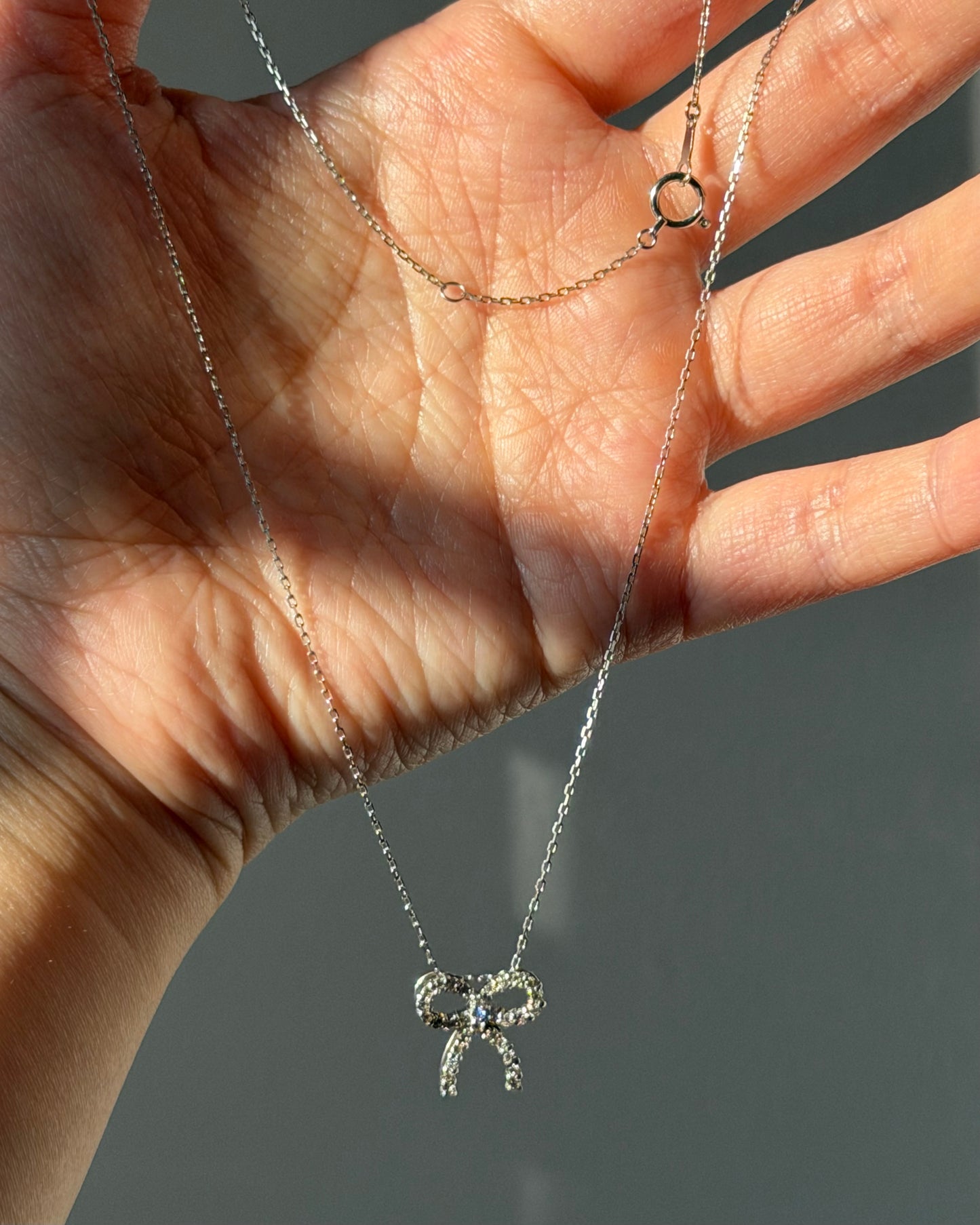 Vintage 18k White Gold Diamond Bow Pendant Necklace