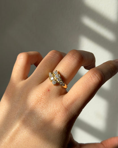 Vintage Circa 1980’s 18k Gold 1.09ctw Graduated Diamond Bypass Ring