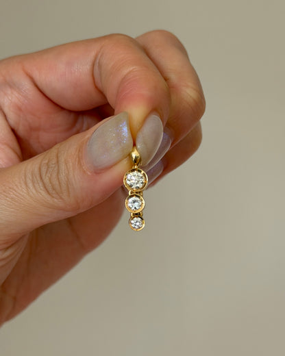 Modern Pre-loved 18k Gold Bezel Set Graduated Diamond Pendant with Clip Bail