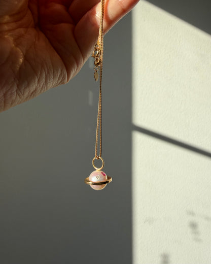 Modern Pre-loved 18k Gold Pearl with Flush Set Ruby and Diamond Saturn Pendant Necklace