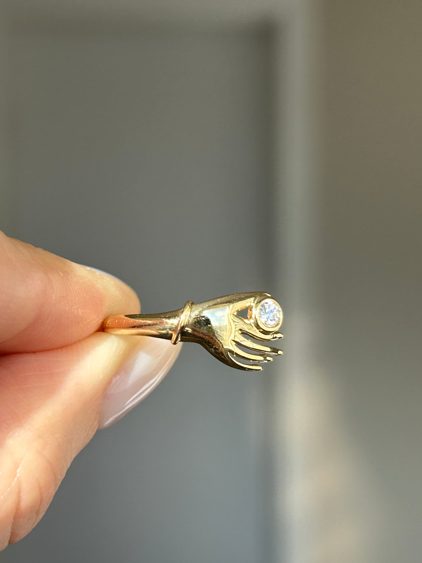 Vintage 18k Gold Hand Motif Ring with a Center Cubic Zirconia