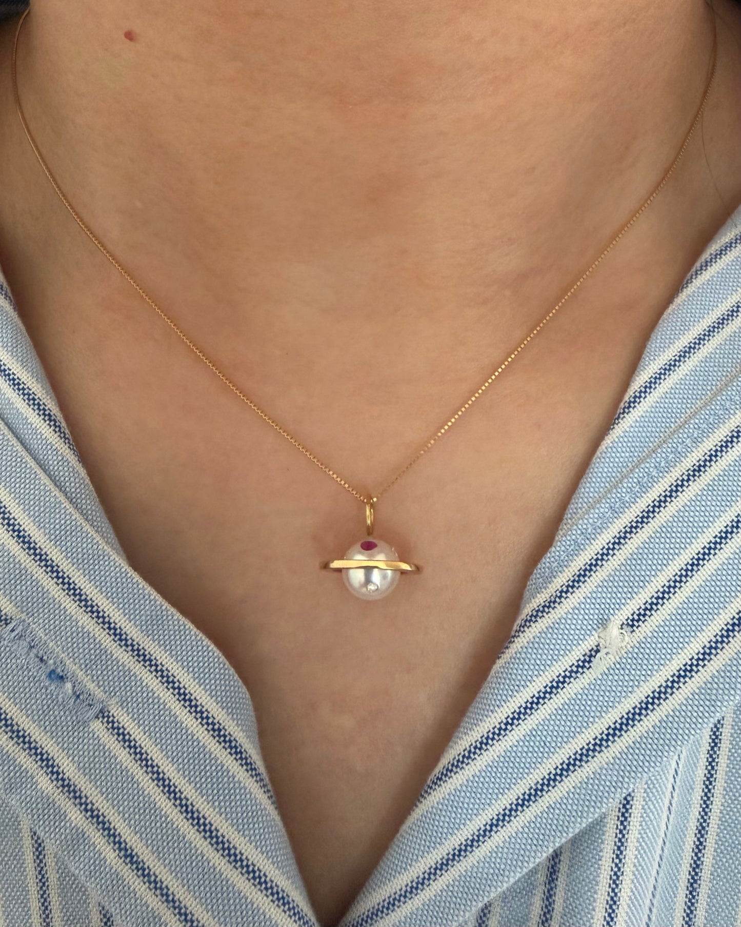 Modern Pre-loved 18k Gold Pearl with Flush Set Ruby and Diamond Saturn Pendant Necklace