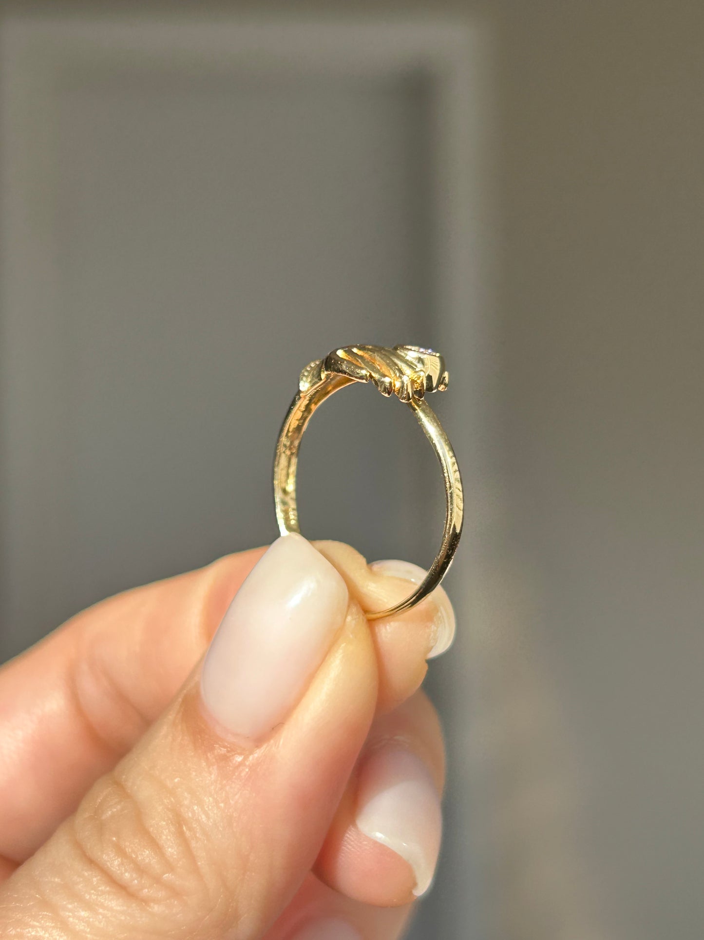 Vintage 18k Gold Hand Motif Ring with a Center Cubic Zirconia