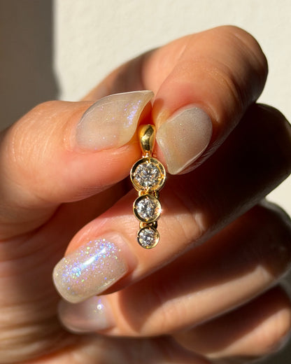 Modern Pre-loved 18k Gold Bezel Set Graduated Diamond Pendant with Clip Bail