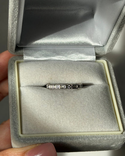 Modern Pre-loved 18k White Gold Bezel Set Baguette and Round Diamond Stacking Band