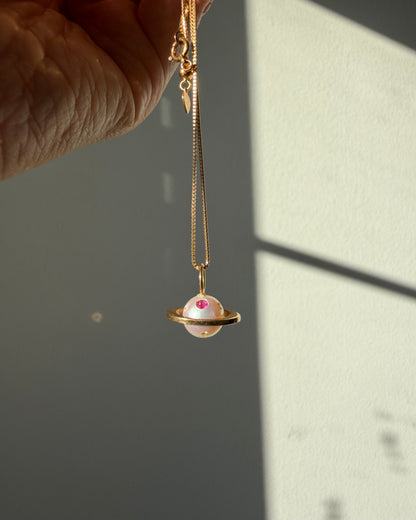 Modern Pre-loved 18k Gold Pearl with Flush Set Ruby and Diamond Saturn Pendant Necklace