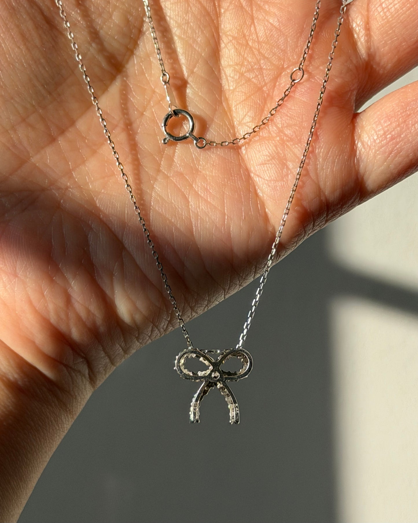 Vintage 18k White Gold Diamond Bow Pendant Necklace