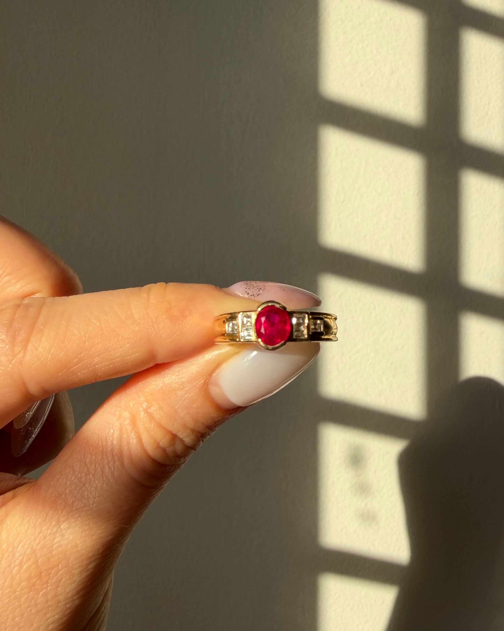  Vintage art deco half bezel set oval ruby and emerald cut diamond ring