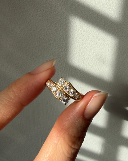Vintage Circa 1980’s 18k Gold 1.09ctw Graduated Diamond Bypass Ring