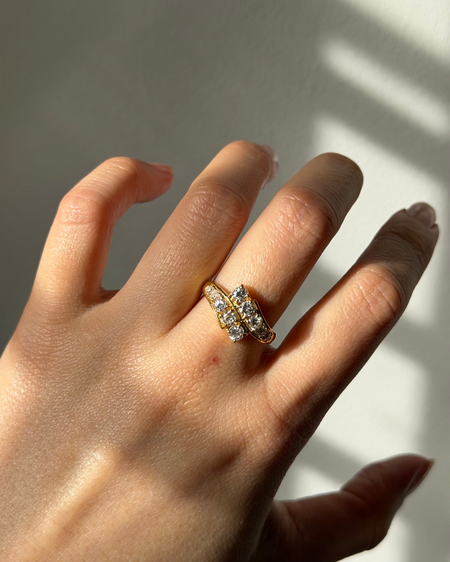 Vintage Circa 1980’s 18k Gold 1.09ctw Graduated Diamond Bypass Ring