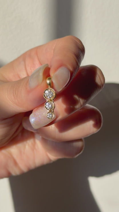 Modern Pre-loved 18k Gold Bezel Set Graduated Diamond Pendant with Clip Bail